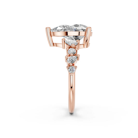 PEAR ENGAGEMENT RING WITH SIDE STONE