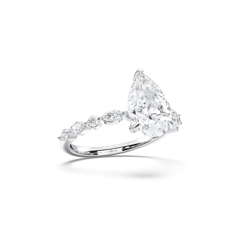 PEAR ENGAGEMENT RING WITH MQ/RD SIDE STONE