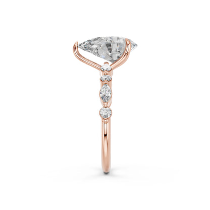 PEAR ENGAGEMENT RING WITH MQ/RD SIDE STONE