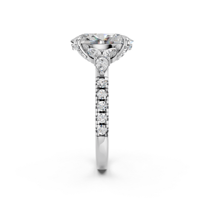 OVAL ENGAGEMENT RING WITH FLORAL SIDE CLUSTERS