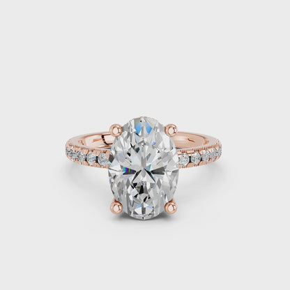 OVAL HIDDEN HALO WITH SIDE STONE PAVE BAND RING