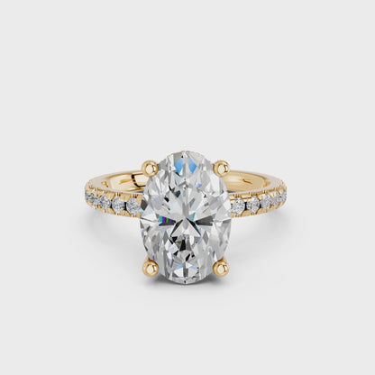 OVAL HIDDEN HALO WITH SIDE STONE PAVE BAND RING