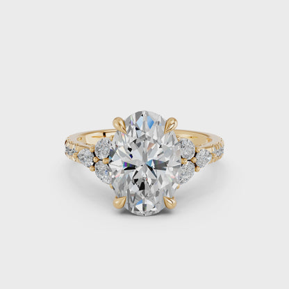 OVAL ENGAGEMENT RING WITH FLORAL SIDE CLUSTERS