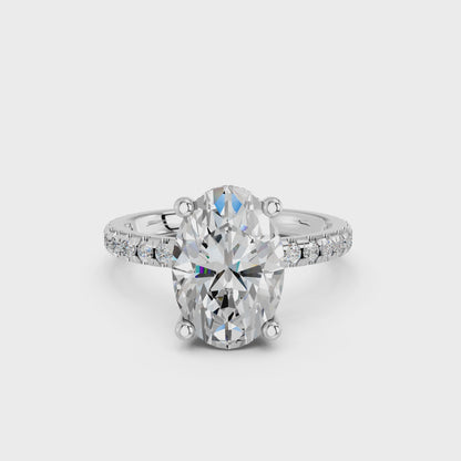 OVAL HIDDEN HALO WITH SIDE STONE PAVE BAND RING