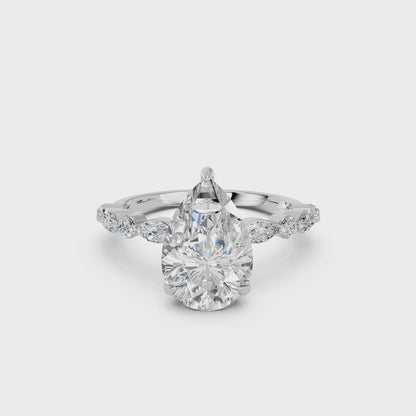 PEAR ENGAGEMENT RING WITH MQ/RD SIDE STONE