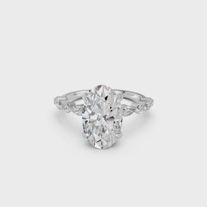 OVAL ENGAGEMENT RING WITH MQ/RD SIDE STONE