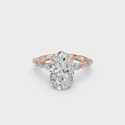 OVAL ENGAGEMENT RING WITH MQ/RD SIDE STONE