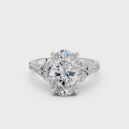 OVAL ENGAGEMENT RING WITH FLORAL SIDE CLUSTERS
